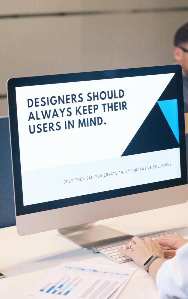 A focused designer works on a user-centric project in a modern office environment.
